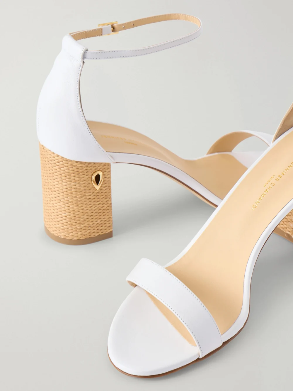 Close-up detail of the Jennifer Chamandi Massimiliano Leather and Raffia Sandals