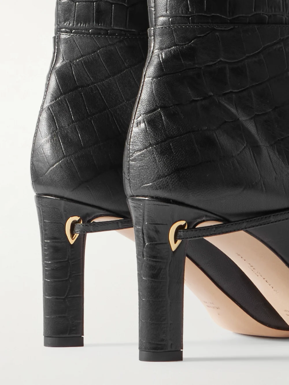 Close-up detail of the Jennifer Chamandi Samu Over-the-knee Croc-effect Leather Boots
