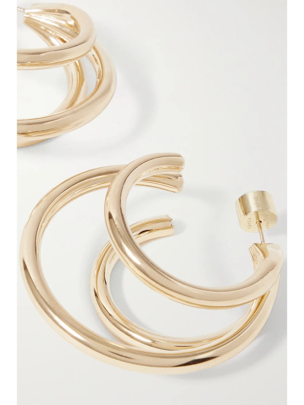 Close-up detail of the Jennifer Fisher Triple Lilly Gold-plated Hoop Earrings