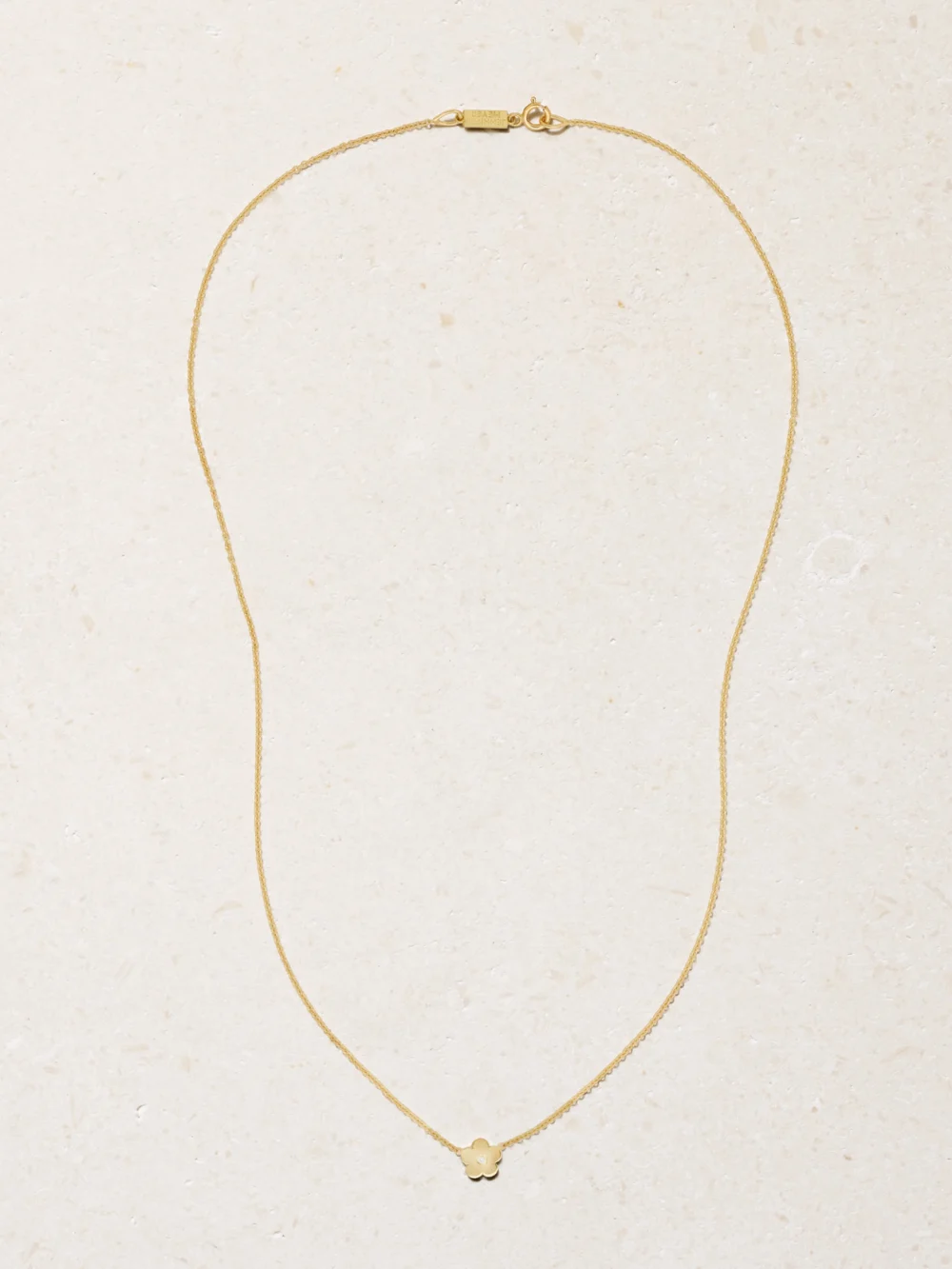 Close-up detail of the Jennifer Meyer Mini Daisy 18-karat Gold Diamond Necklace