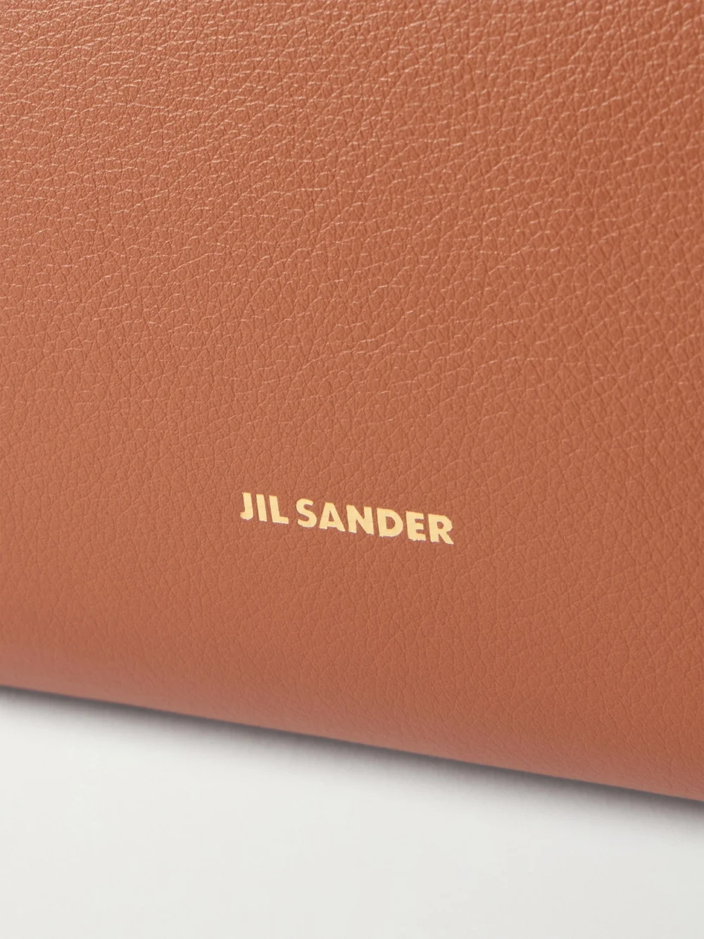 Close-up detail of the Jil Sander Cannolo Leather Shoulder Bag
