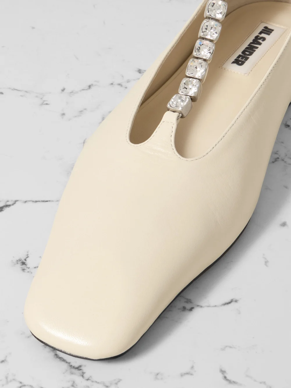 Close-up detail of the Jil Sander Crystal-embellished Leather Ballet Flats