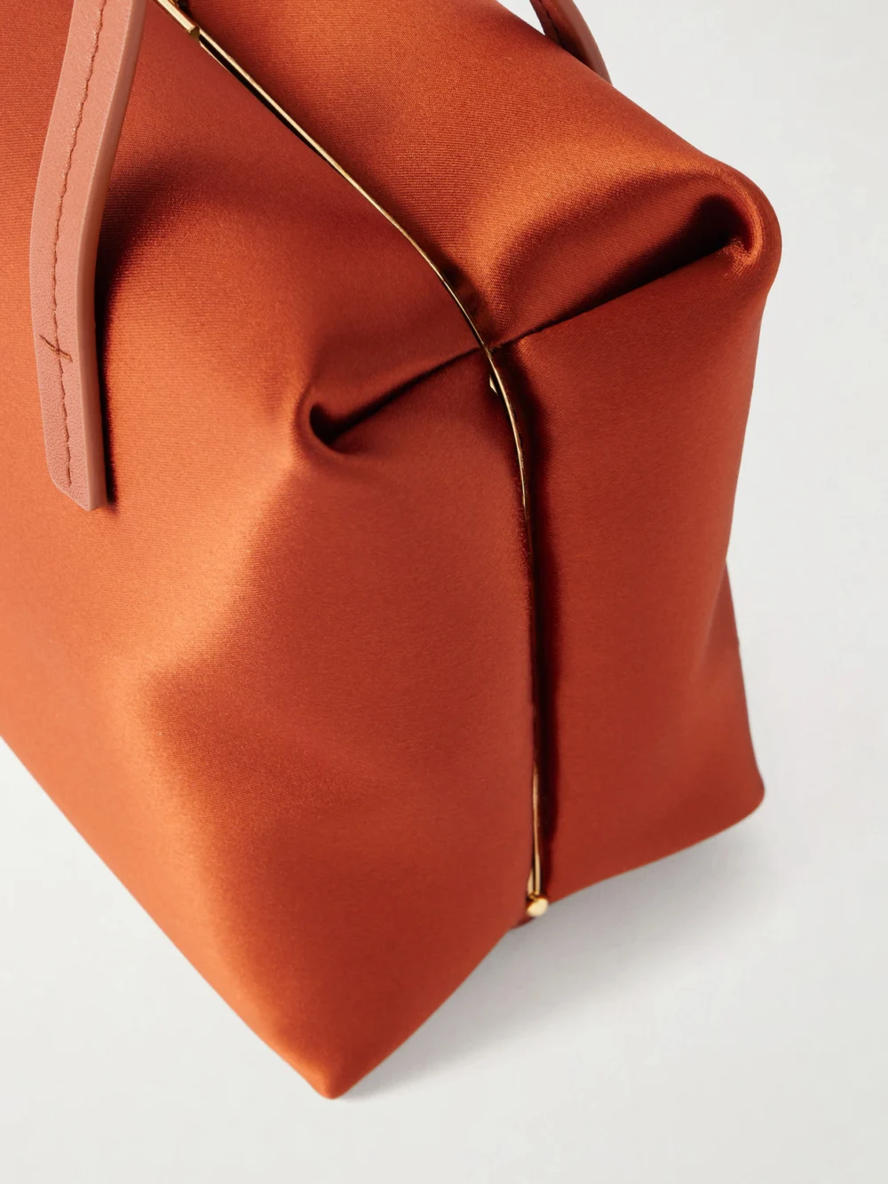Close-up detail of the Jil Sander Goji Pillow Satin Shoulder Bag