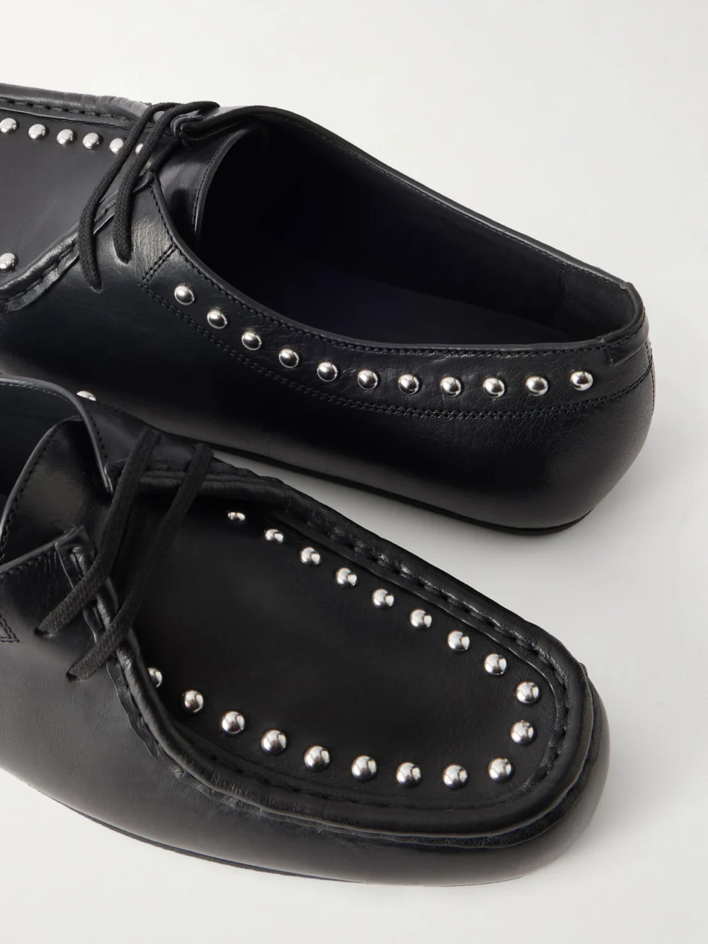 Close-up detail of the Jil Sander Hood Studded Leather Loafers