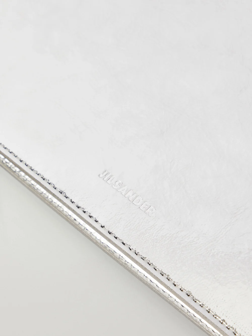 Close-up detail of the Jil Sander Otto Small Metallic-leather Shoulder Bag