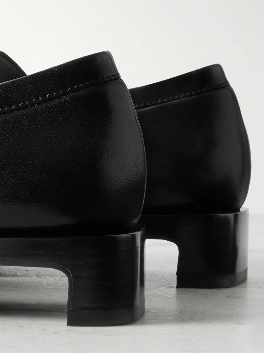 Close-up detail of the Jil Sander Ruched Crinkled-leather Penny Loafers