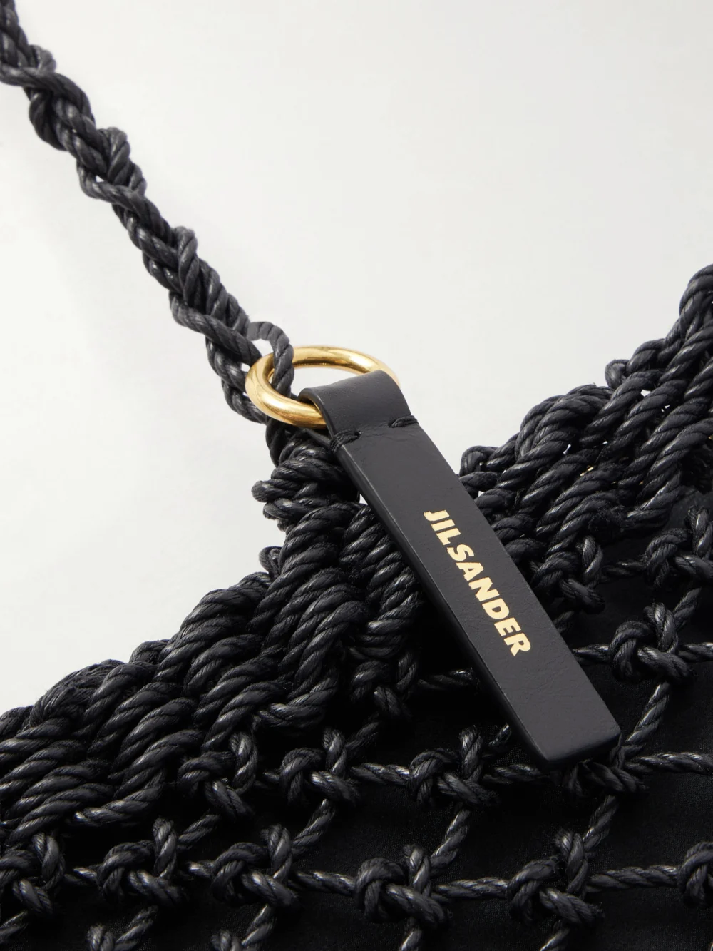 Close-up detail of the Jil Sander Tangle Net Satin and Cotton Cord Shoulder Bag