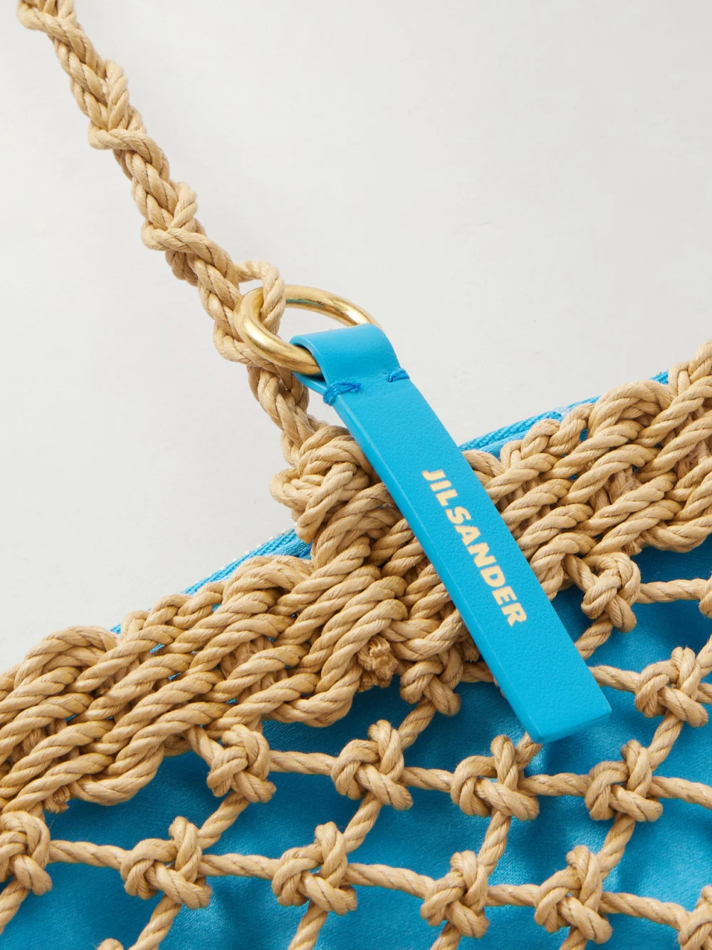 Close-up detail of the Jil Sander Tangle Net Satin and Cotton Cord Shoulder Bag