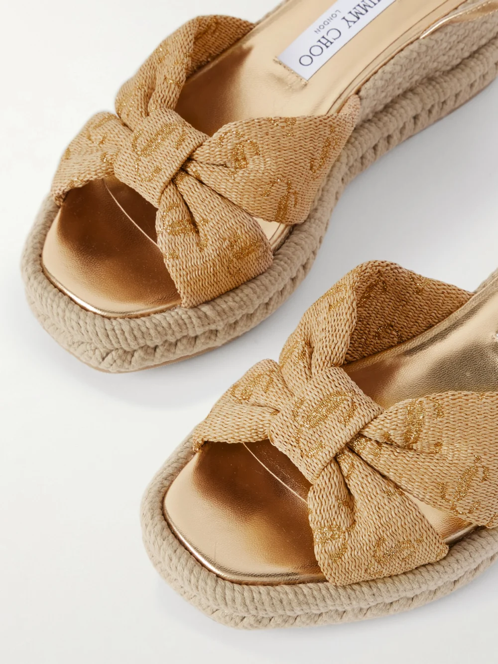 Close-up detail of the Jimmy Choo Aella 60 Raffia-jacquard and Leather Wedge Sandals