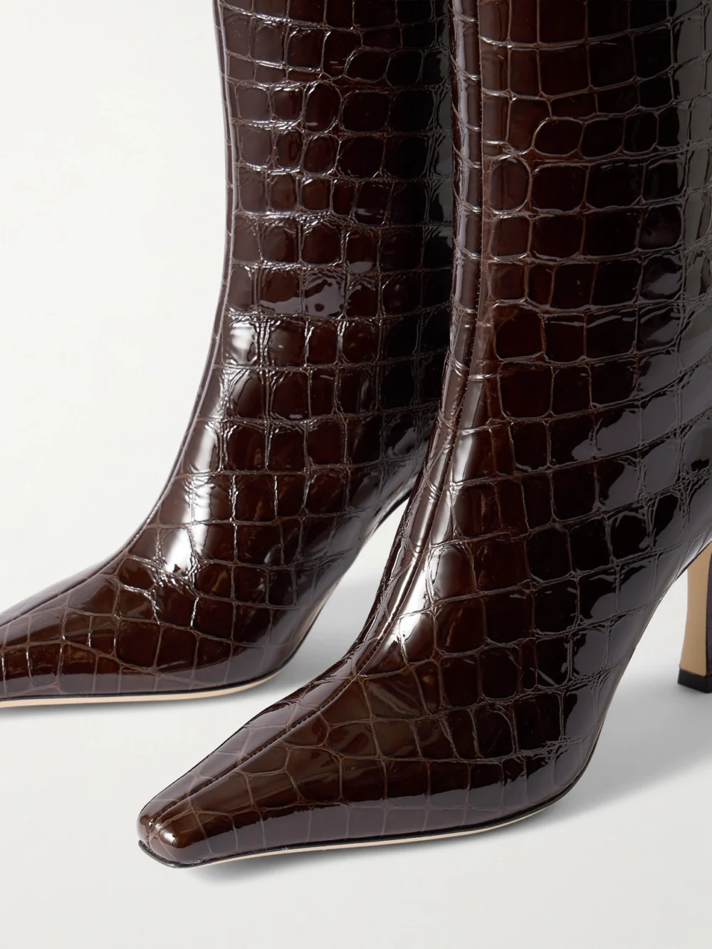 Close-up detail of the Jimmy Choo Agathe 85 Croc-effect Leather Knee Boots