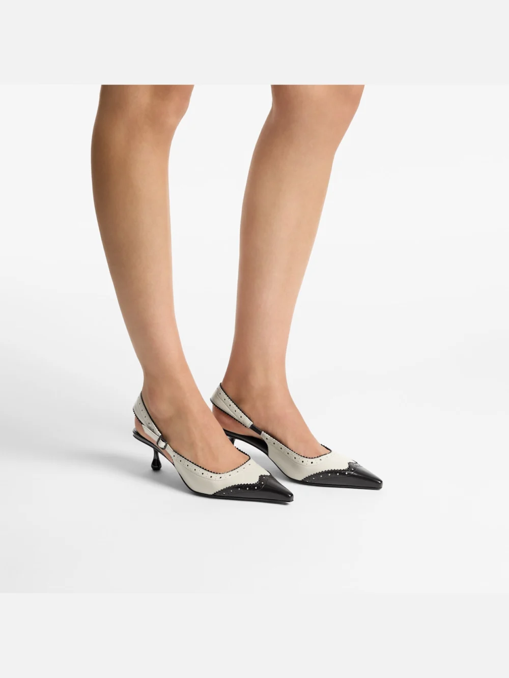 Side view of the Jimmy Choo Amel 50 Black and Bone Leather Slingbacks with Brogue Detailing