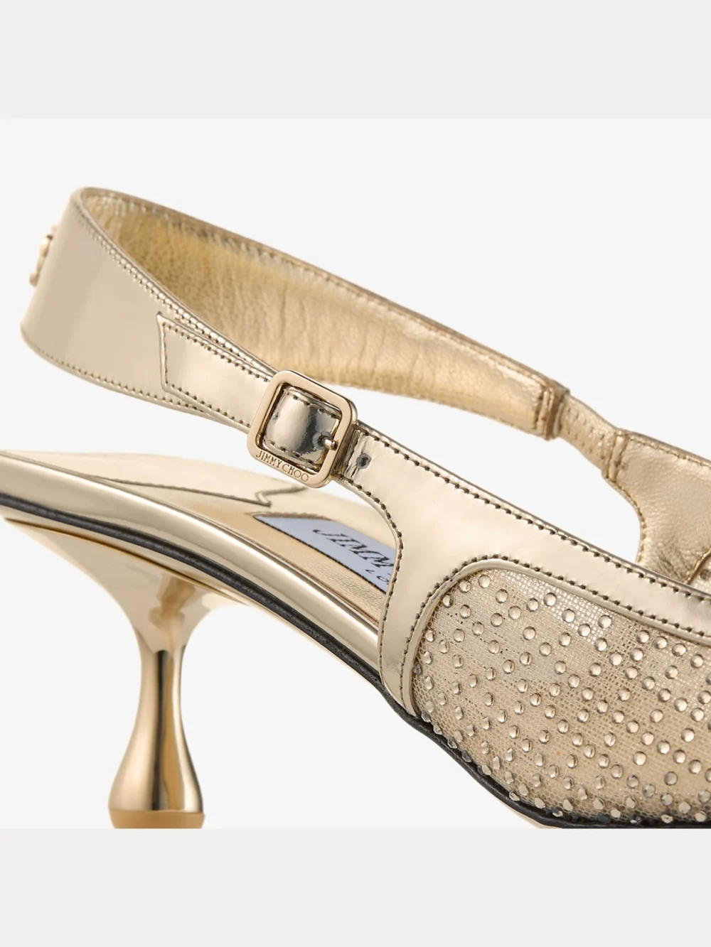 Close-up detail of the Jimmy Choo Amel 50 Gold Illusion Crystal Mesh and Liquid Metal Leather Pumps