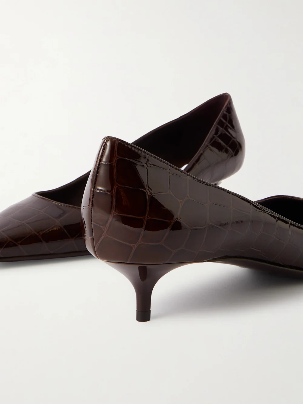 Close-up detail of the Jimmy Choo Amelia Croc-effect Leather Pumps