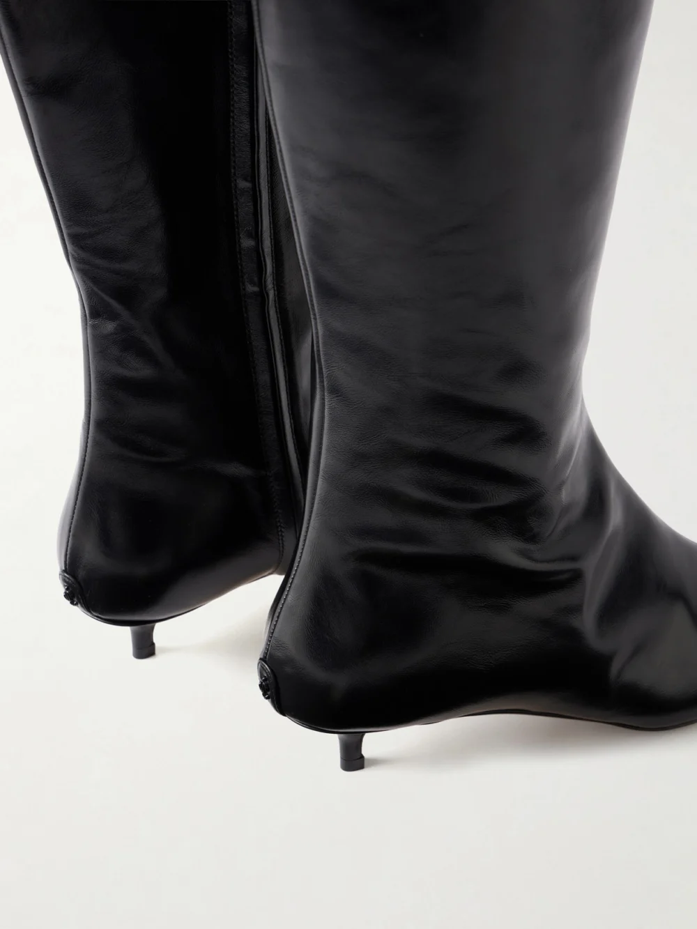 Close-up detail of the Jimmy Choo Amis 35 Leather Knee Boots