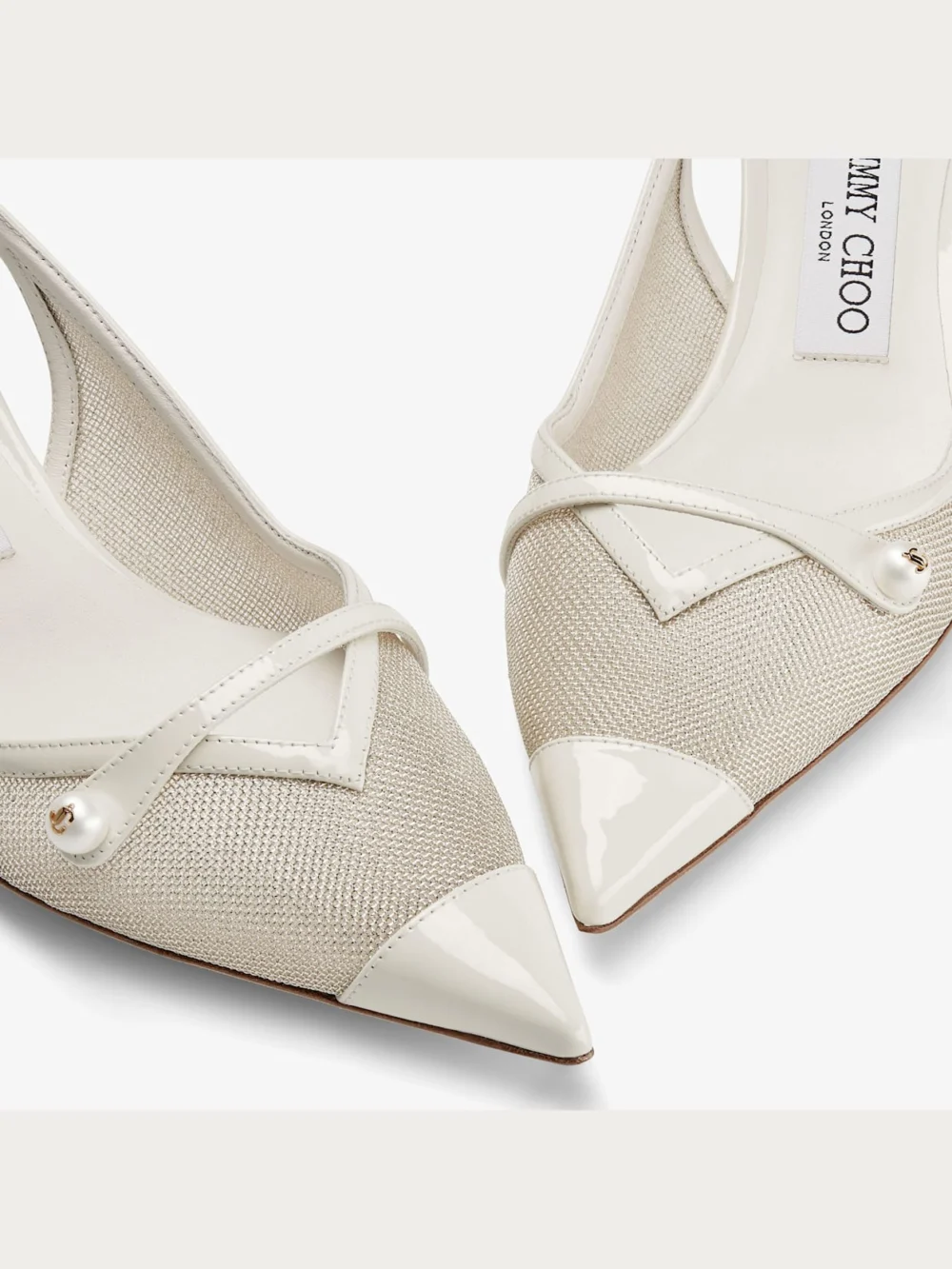 Close-up detail of the Jimmy Choo Amita 45 Latte and Champagne Patent and Metallic Mesh Sling Back Pumps