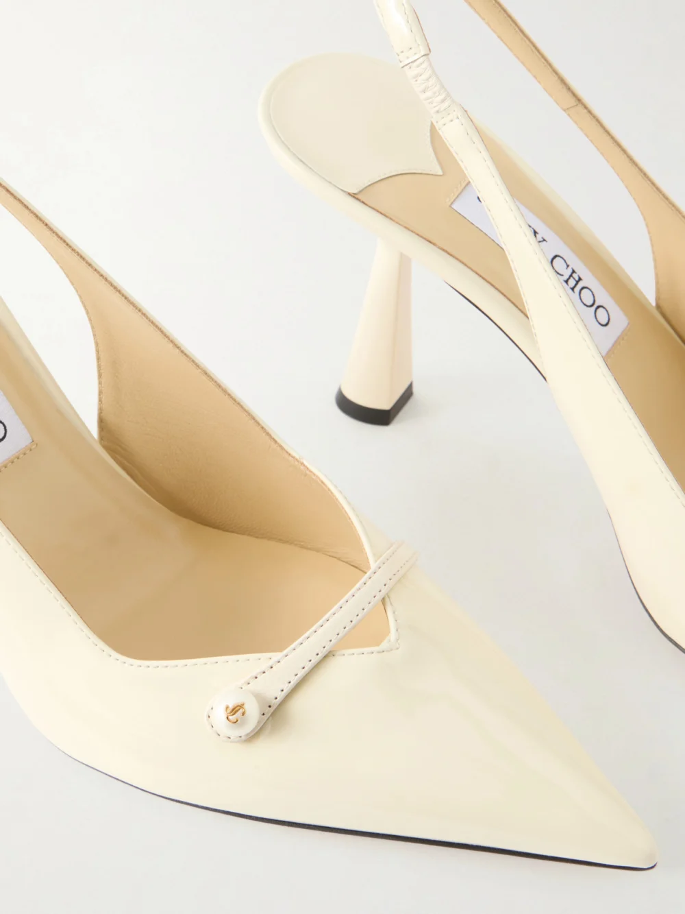 Close-up detail of the Jimmy Choo Amita 85 Embellished Patent-leather Slingback Pumps