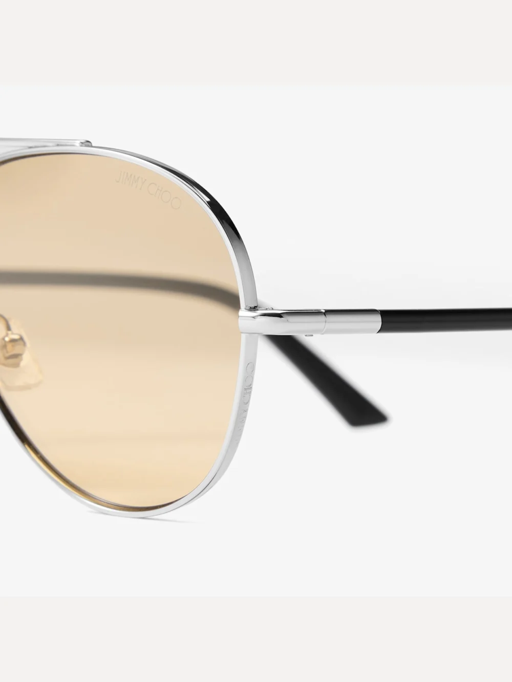 Close-up detail of the Jimmy Choo Astor Silver and Light Yellow Metal Aviator Sunglasses