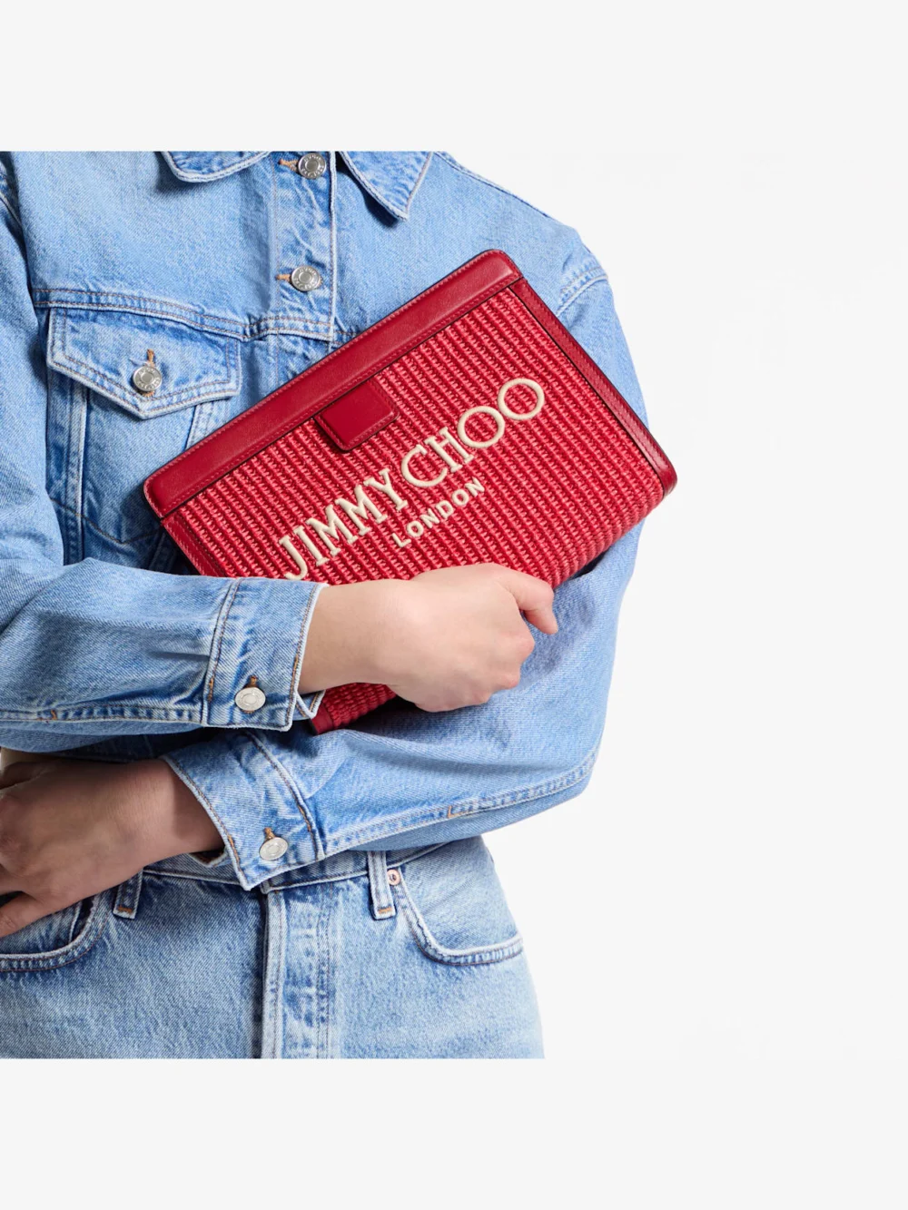 Side view of the Jimmy Choo Avenue London Pouch Ruby Red and Light Gold Embroidered Raffia and Leather Pouch