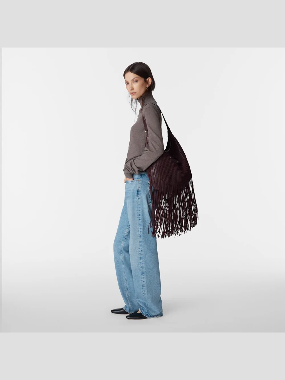 Close-up detail of the Jimmy Choo Bar Hobo Medium Deep Merlot Biker Leather Shoulder Bag with Suede Fringes