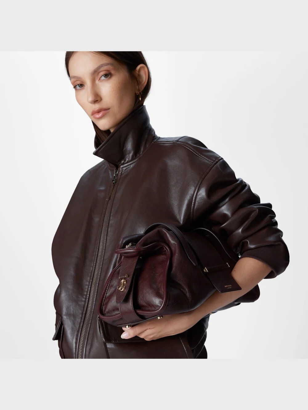 Close-up detail of the Jimmy Choo Bar Holdall Medium Deep Merlot Biker Leather Holdall Bag