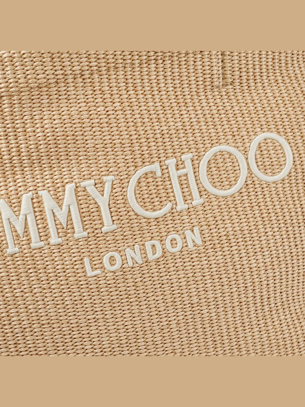 Close-up detail of the Jimmy Choo Beach Tote East-West Natural Raffia Embroidered Tote Bag