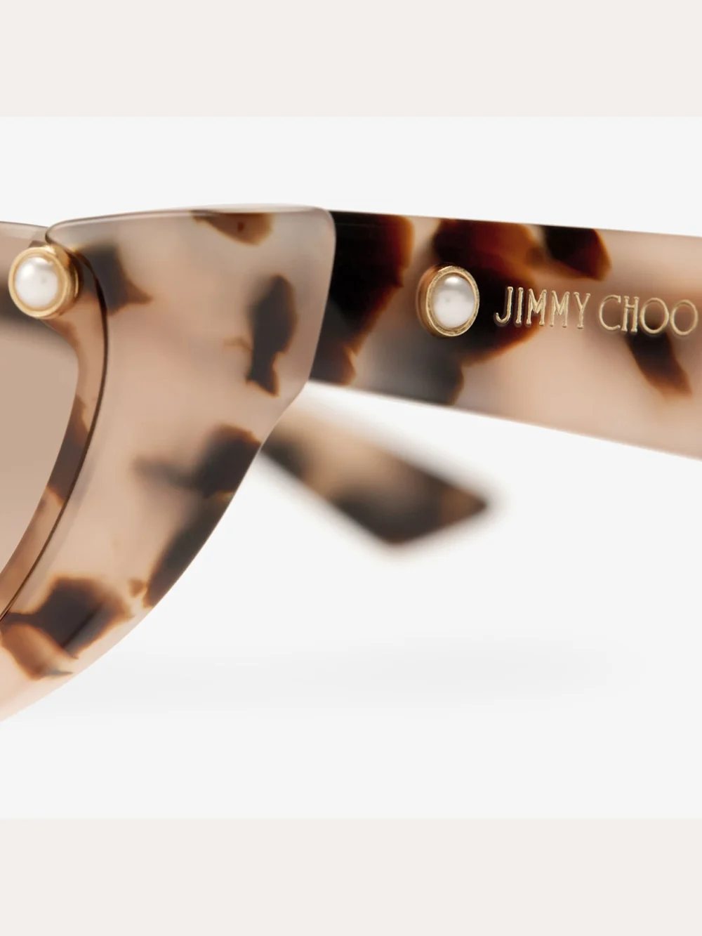 Close-up detail of the Jimmy Choo Beth Pink Havana Cat Eye Sunglasses