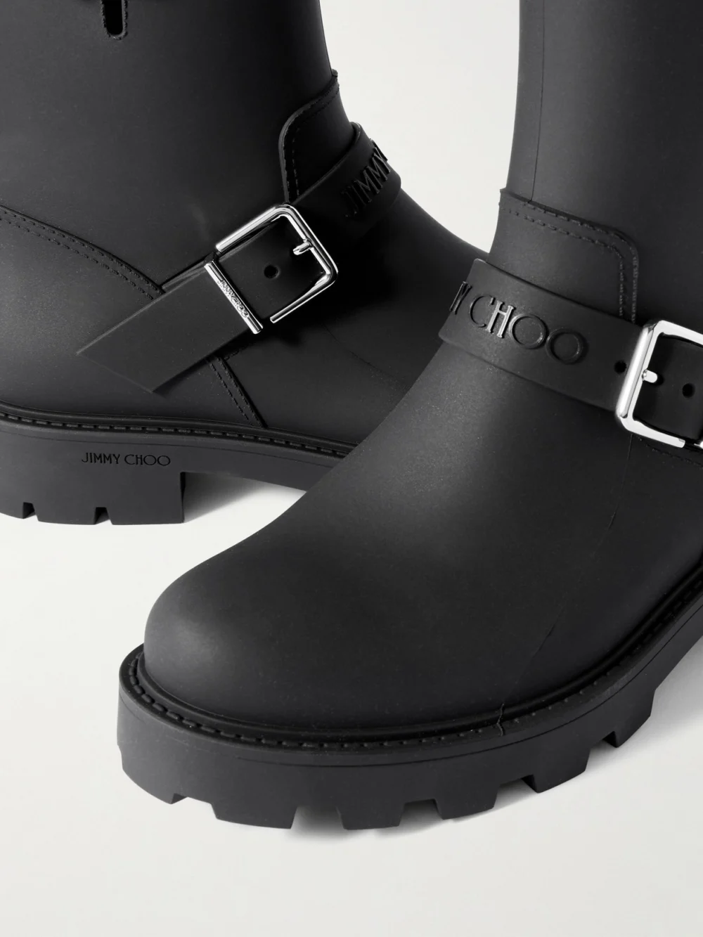 Close-up detail of the Jimmy Choo Biker Rain 40 Buckled Rubber Ankle Boots