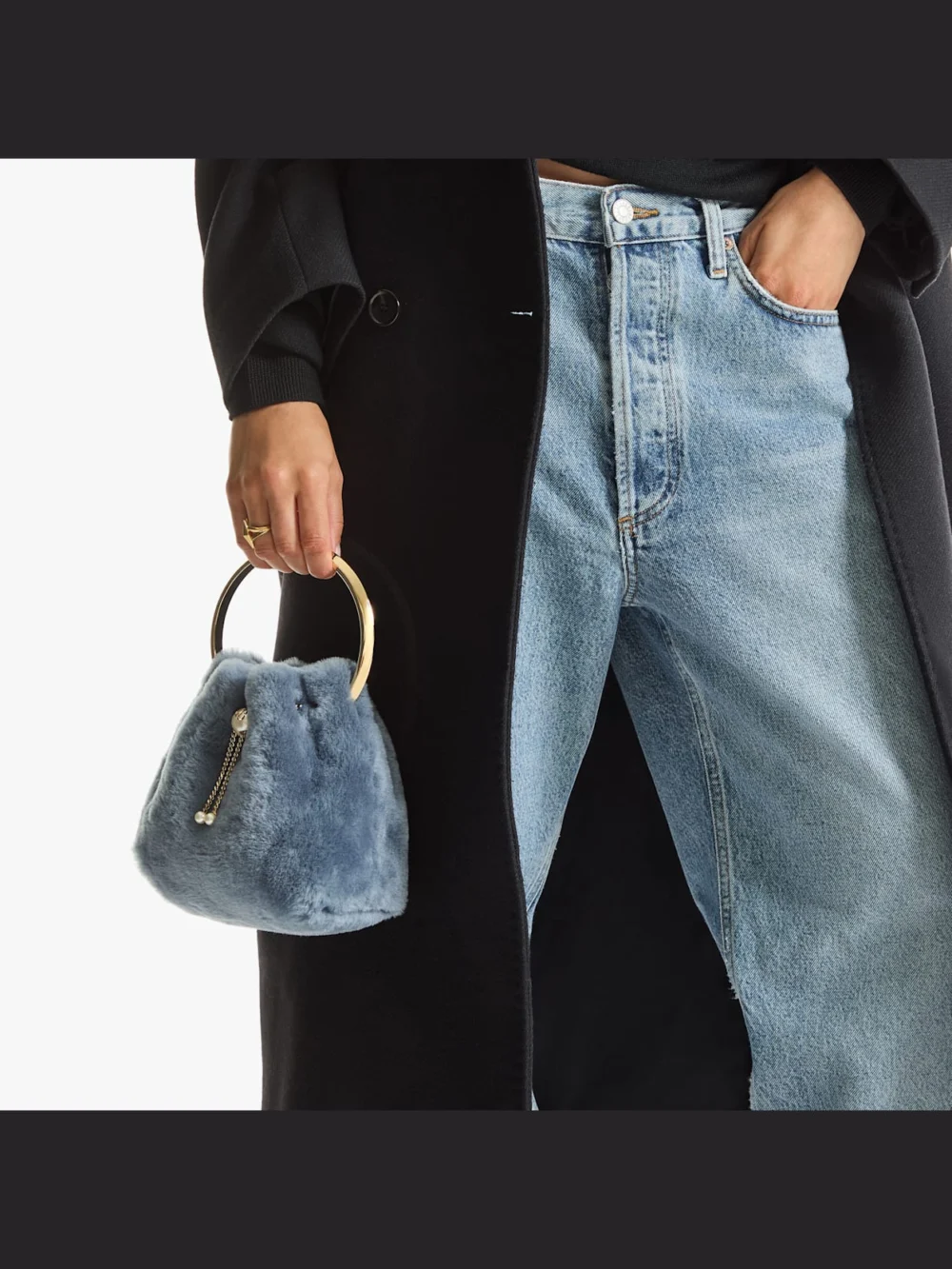 Side view of the Jimmy Choo Bon Bon Arctic Blue Shearling Bucket Bag