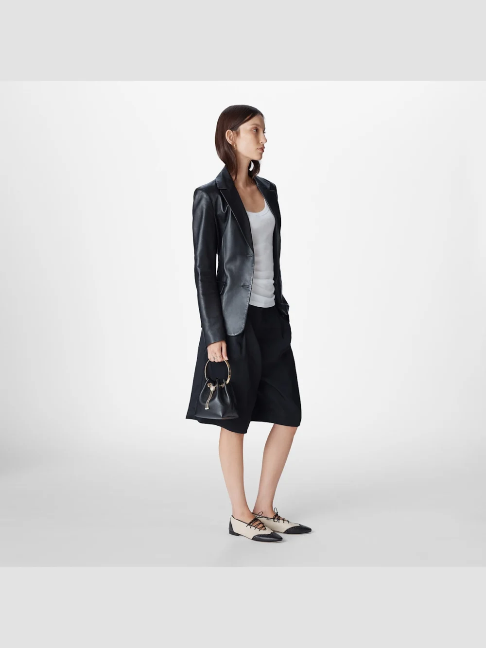 Side view of the Jimmy Choo Bon Bon Biker Leather Black Bag with Pearl Closure