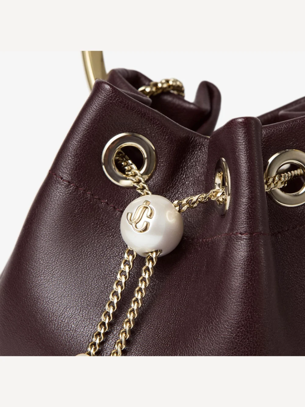 Close-up detail of the Jimmy Choo Bon Bon Deep Merlot Biker Leather Bag with Pearl Closure