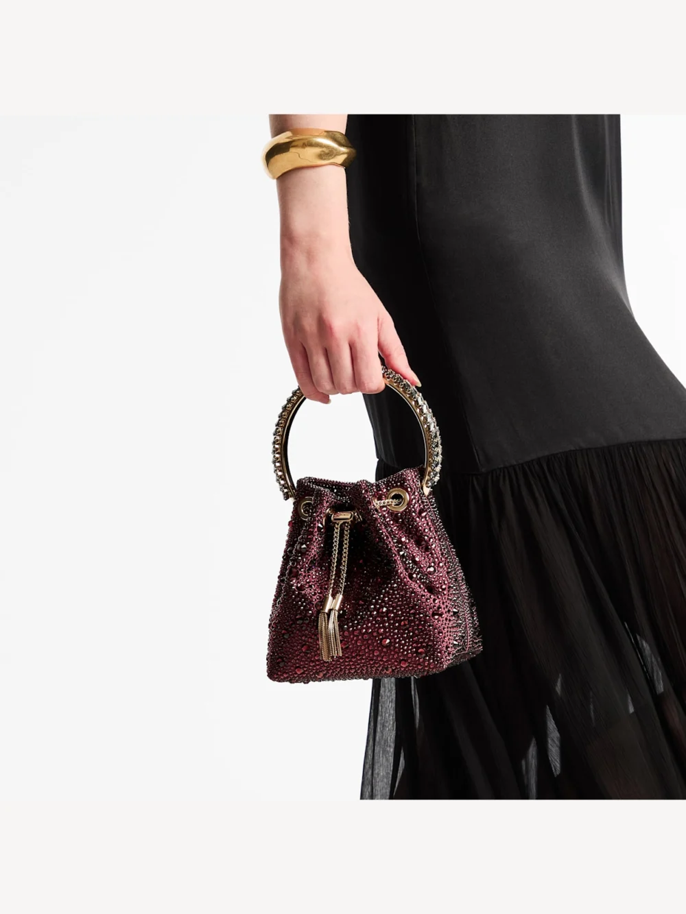 Side view of the Jimmy Choo Bon Bon Deep Merlot Satin and Crystal Hotfix Bucket Bag with Crystal Handle