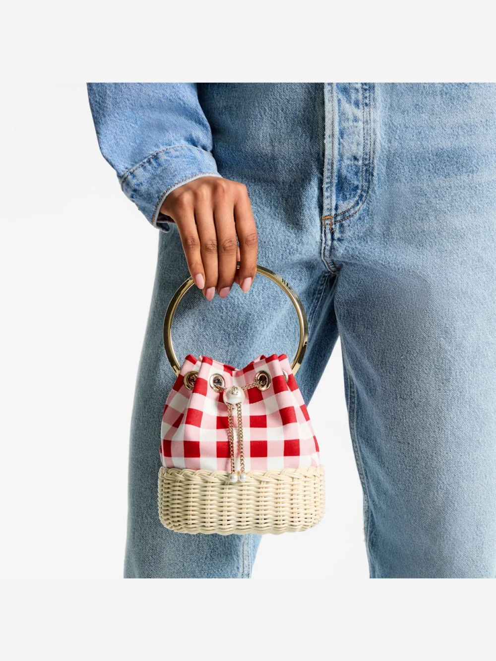 Side view of the Jimmy Choo Bon Bon Ruby Red Gingham Cotton Fabric and Wicker Bucket Bag