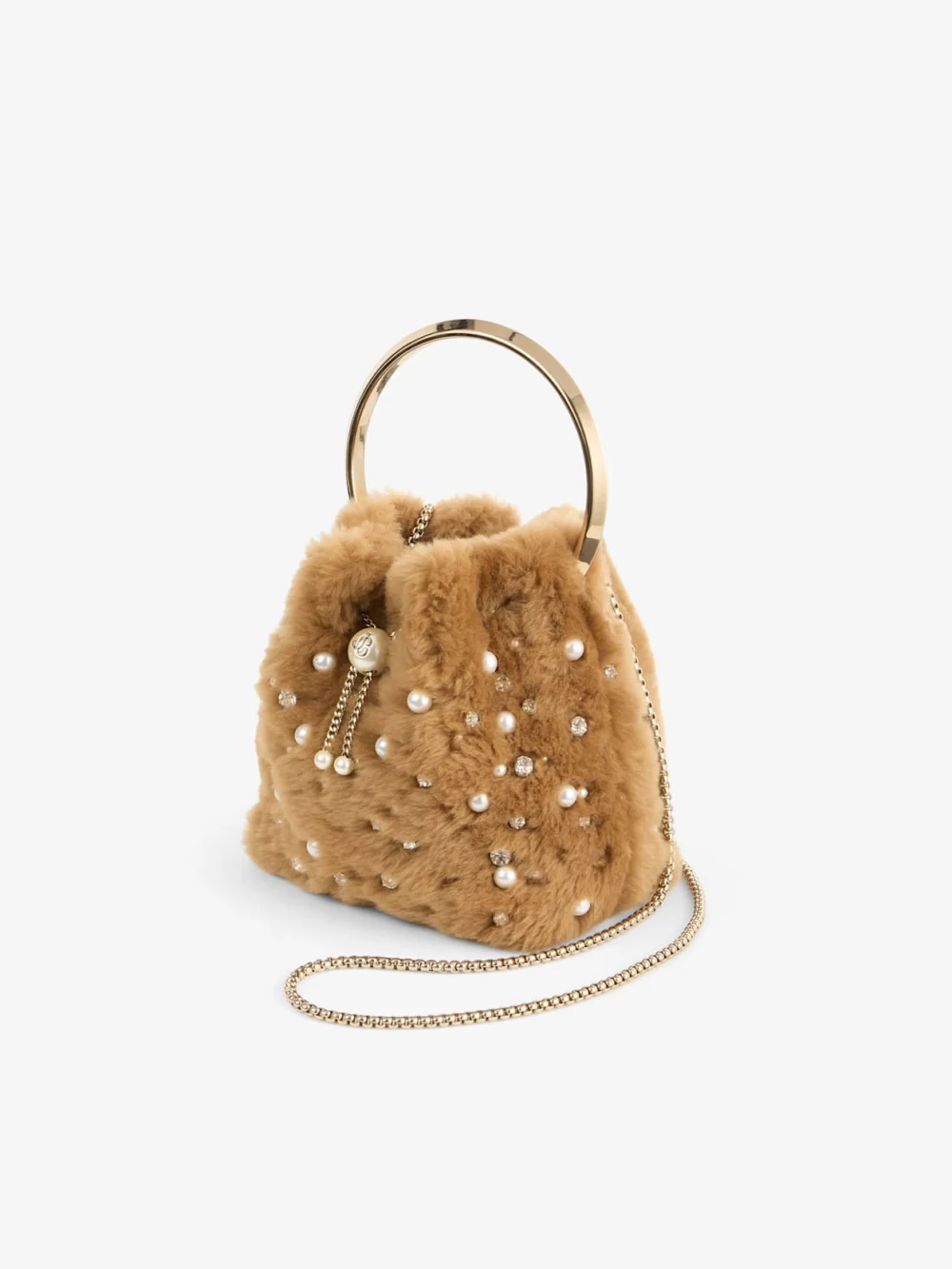 Side view of the Jimmy Choo Bon Bon Toffee Shearling Bucket Bag with Embroidered Pearls and Crystals