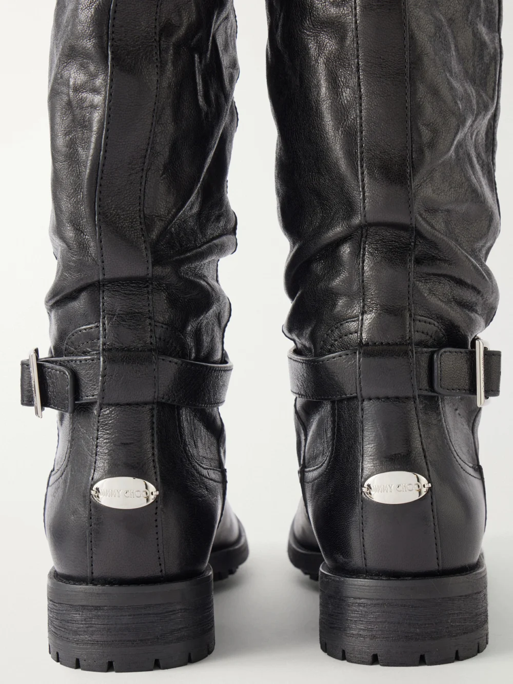 Close-up detail of the Jimmy Choo Buckle-detailed Leather Knee Boots