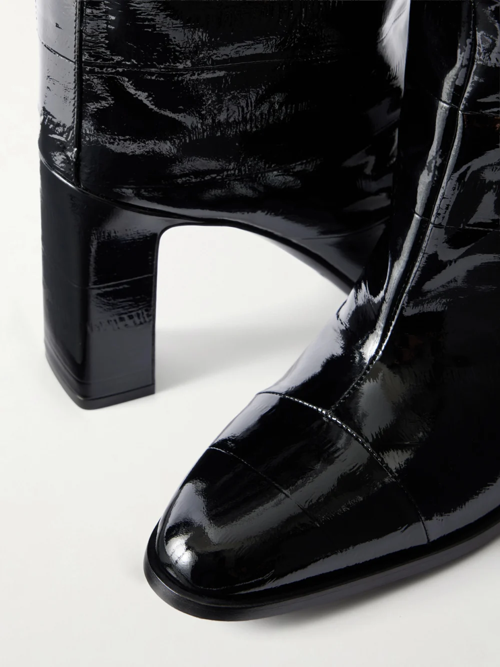 Close-up detail of the Jimmy Choo Caly 85 Textured-leather Knee Boots