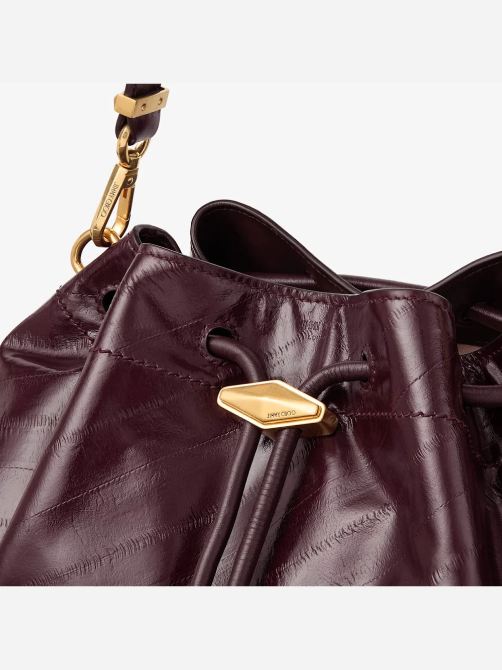 Close-up detail of the Jimmy Choo Cinch Medium Barolo Matte Eel Printed Leather Shoulder Bag