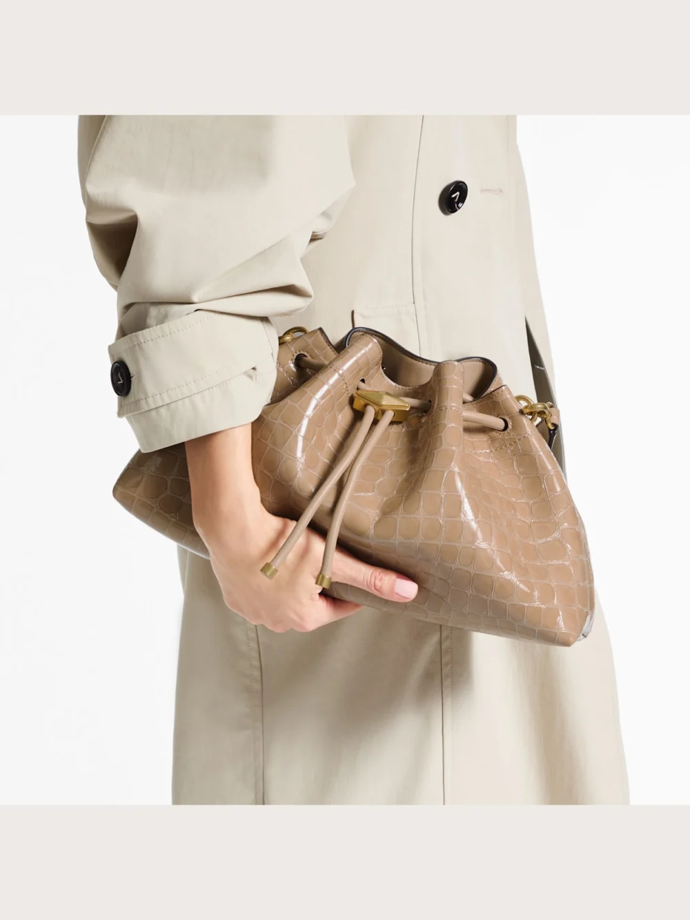 Side view of the Jimmy Choo Cinch Medium Chai Shiny Croc Embossed Leather Shoulder Bag