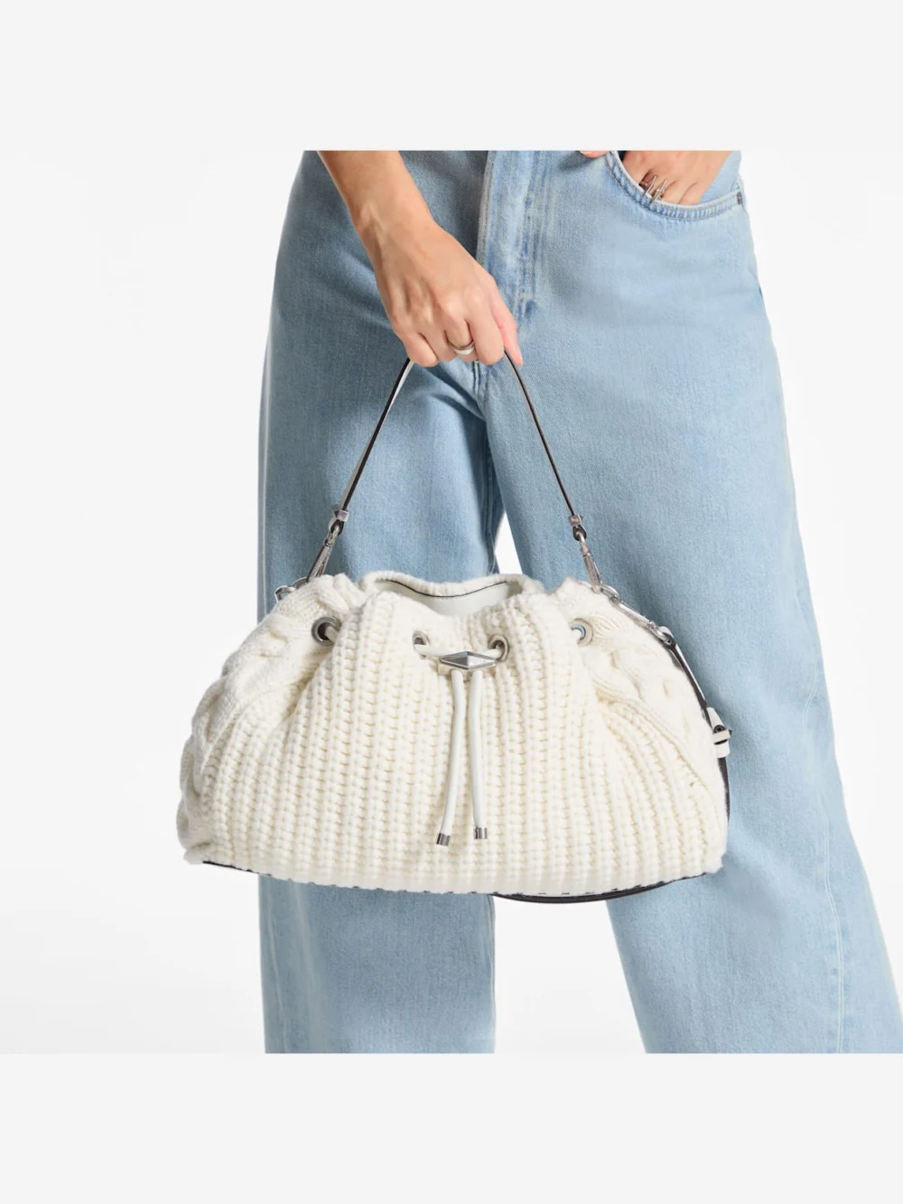 Side view of the Jimmy Choo Cinch Medium Latte Knitted Wool Shoulder Bag