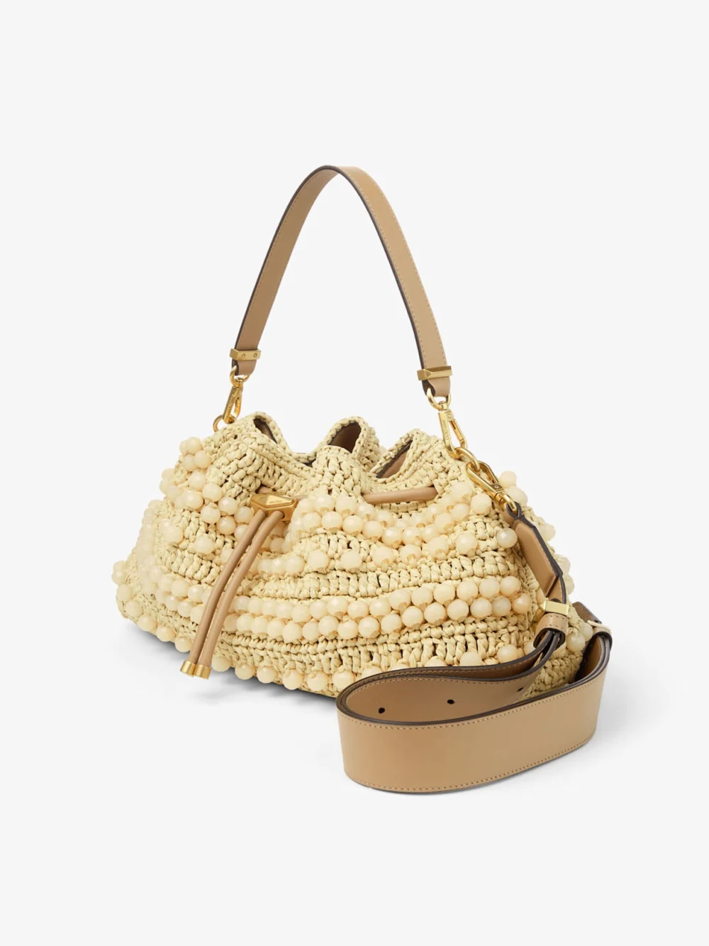 Close-up detail of the Jimmy Choo Cinch Medium Natural and Cappuccino Beaded Raffia Bucket Bag with Smooth Calf Leather