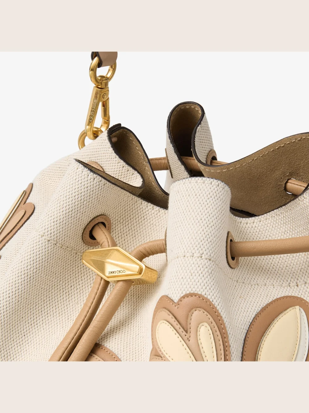 Back view of the Jimmy Choo Cinch Medium Natural and Chai Recycled Canvas Shoulder Bag with Intarsia Appliqué