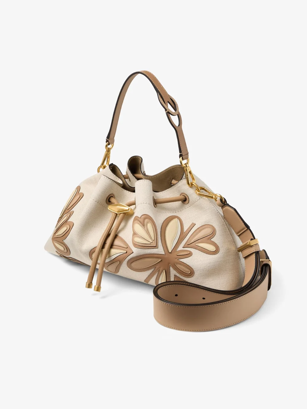 Close-up detail of the Jimmy Choo Cinch Medium Natural and Chai Recycled Canvas Shoulder Bag with Intarsia Appliqué