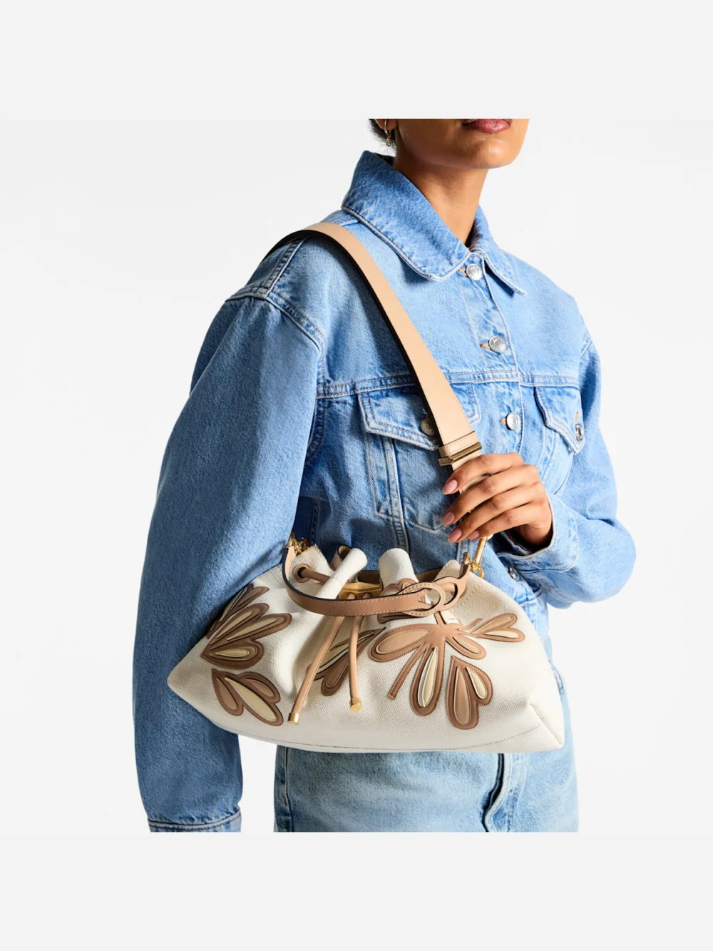 Side view of the Jimmy Choo Cinch Medium Natural and Chai Recycled Canvas Shoulder Bag with Intarsia Appliqué