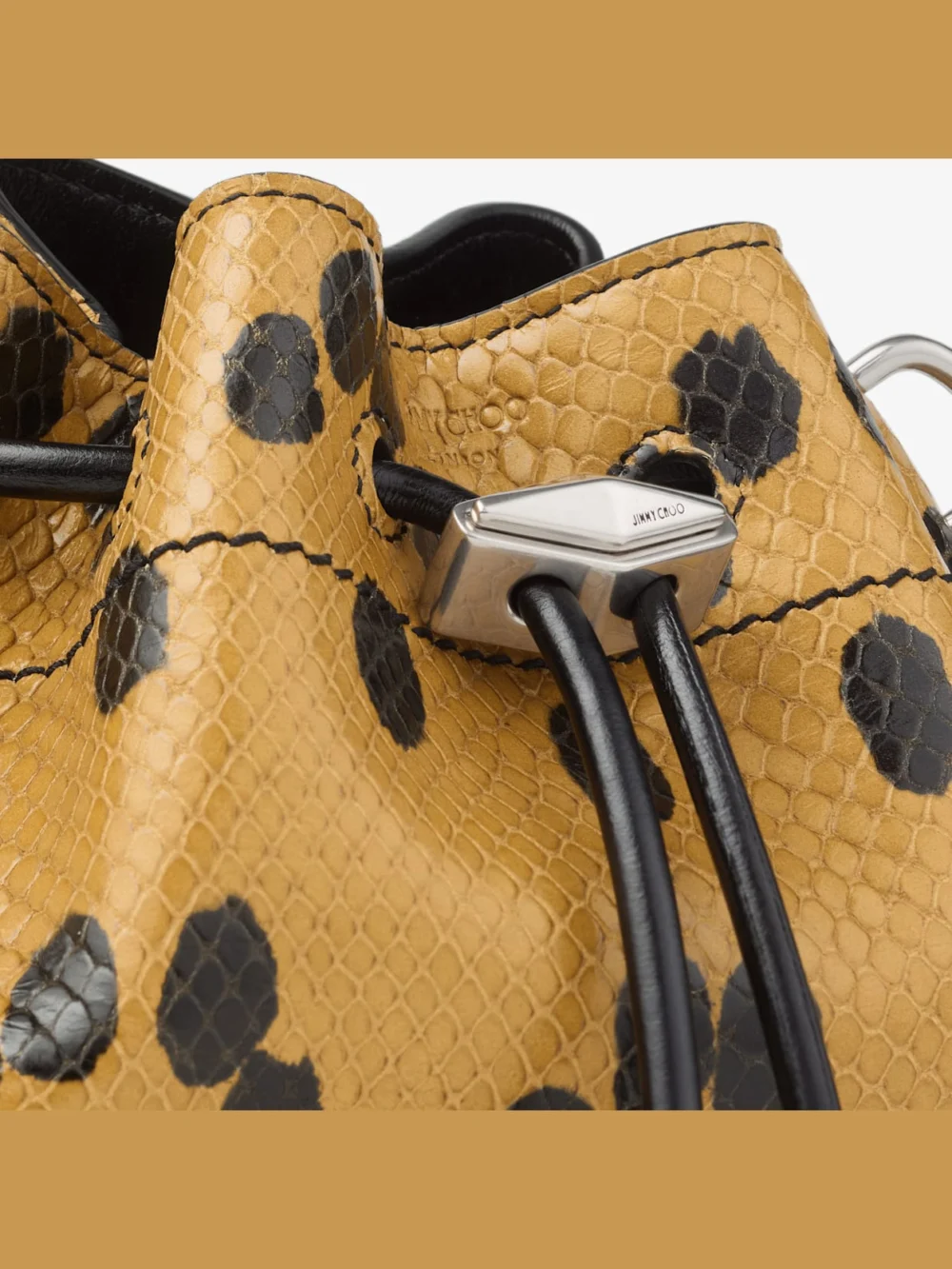 Back view of the Jimmy Choo Cinch Small Cigar and Black Spotted Elaphe Printed Leather Shoulder Bag
