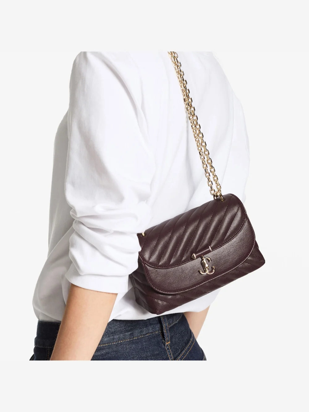 Side view of the Jimmy Choo Curve Crossbody Small Deep Merlot Quilted Biker Leather Crossbody Bag