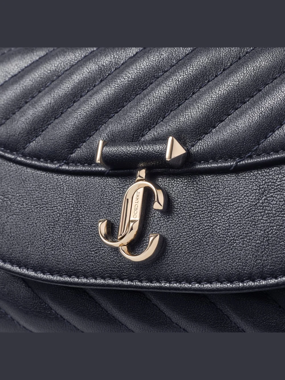 Back view of the Jimmy Choo Curve Crossbody Small Marine Quilted Biker Leather Crossbody Bag