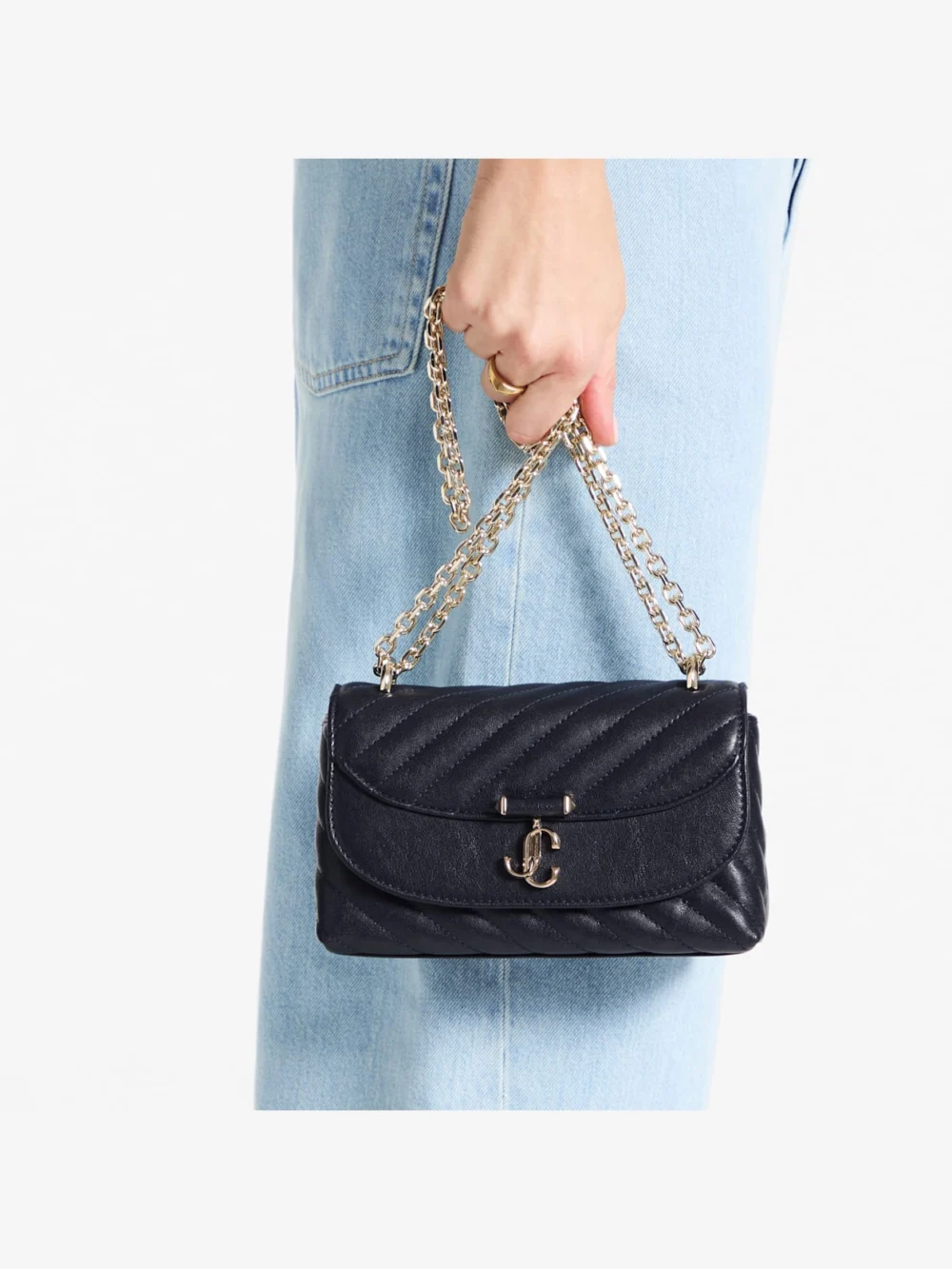 Side view of the Jimmy Choo Curve Crossbody Small Marine Quilted Biker Leather Crossbody Bag