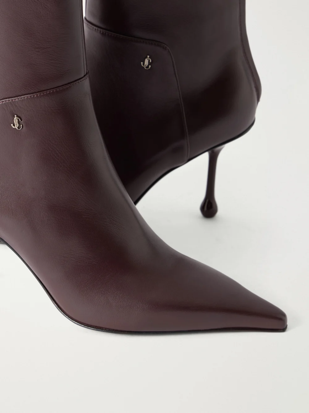 Close-up detail of the Jimmy Choo Cycas 80 Logo-embellished Leather Ankle Boots