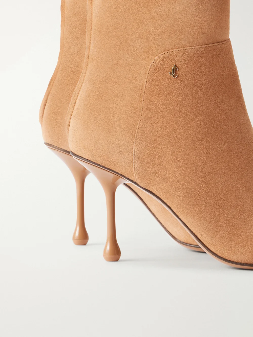 Close-up detail of the Jimmy Choo Cycas 80 Logo-embellished Suede Ankle Boots