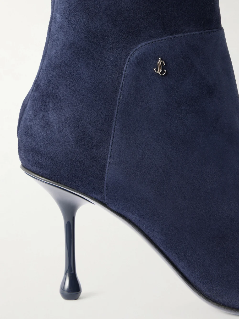 Close-up detail of the Jimmy Choo Cycas 80 Logo-embellished Suede Ankle Boots