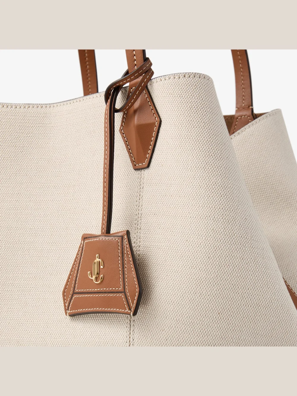 Back view of the Jimmy Choo Diamond Tote Medium Natural and Tan Recycled Canvas Tote Bag with Leather Trim